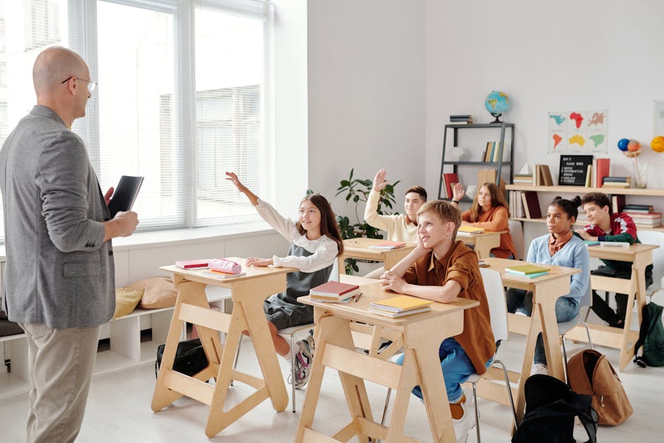 Students engage eagerly in a classroom, raising hands and participating in a lesson